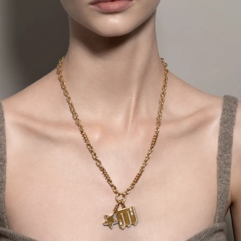 white_mother_of_pearl_yel_1-16.webp WHITE MOTHER OF PEARL YELLOW GOLD STAR CHARM>Boochier Fashion