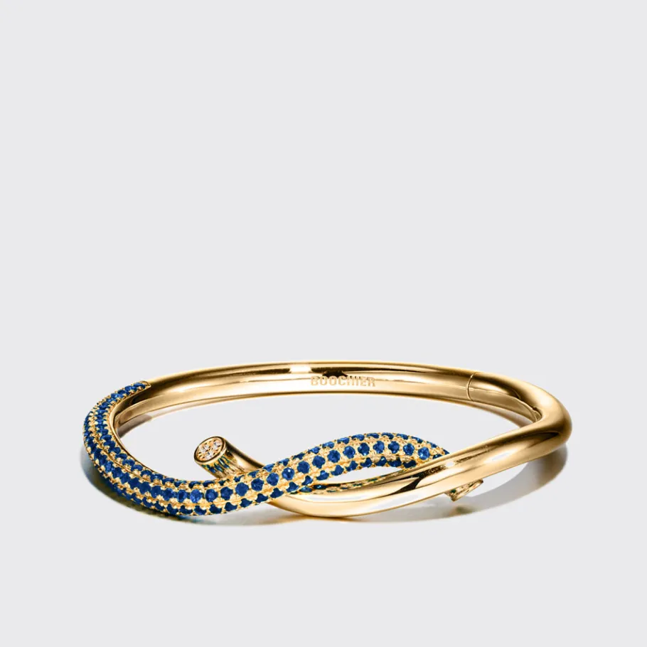 yellow_gold_half_blue_sap_0.webp YELLOW GOLD HALF BLUE SAPPHIRE TIES BANGLE>Boochier Hot